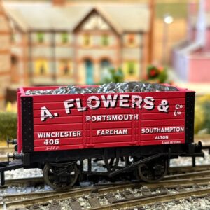 Red A. Flowers & Co. Portsmouth OO gauge coal wagon on a model railway layout