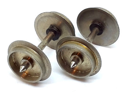 Two metal model railway wheelsets showing the wheel treads and axles